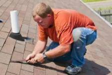 Man repairing a roof