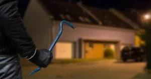 Burglar in front of house